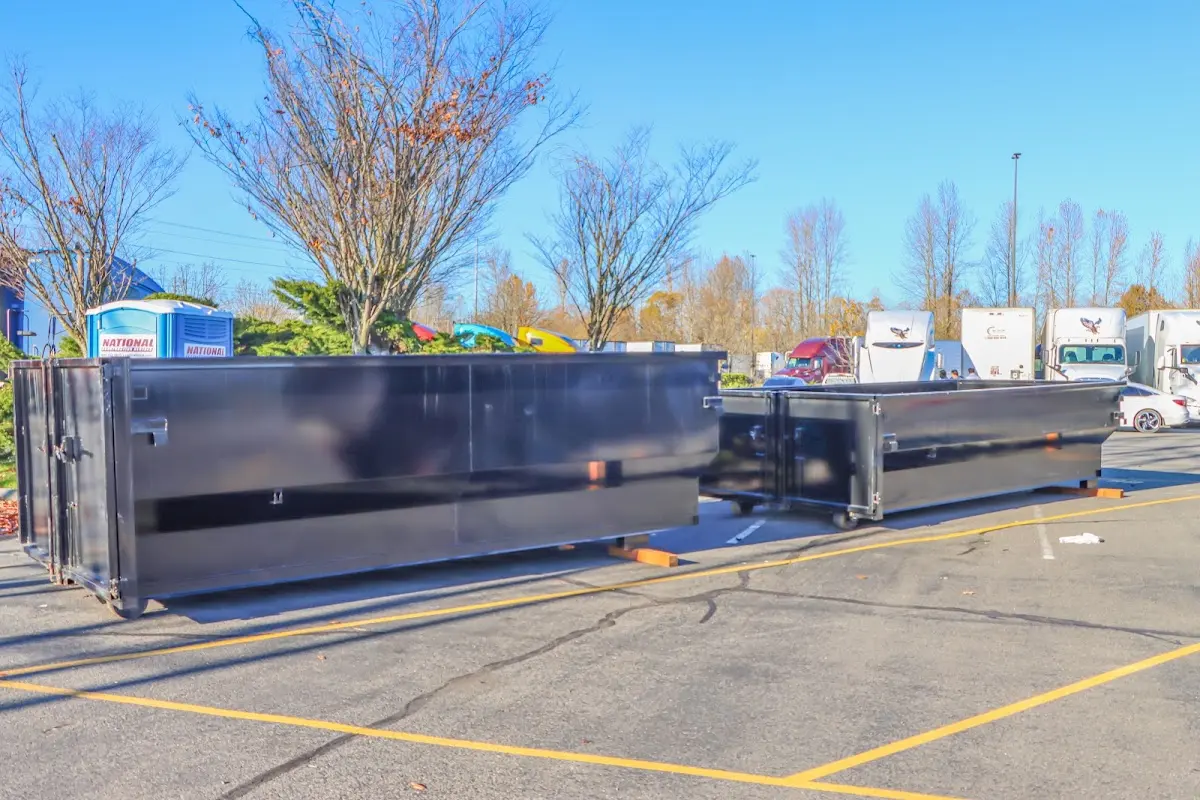 Professional dumpster rental service with roll-off container on residential driveway in Sewickley